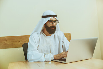 Image showing Arabian saudi businessman working in office