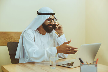 Image showing Arabian saudi businessman working in office