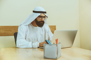 Image showing Arabian saudi businessman working in office