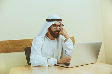 Image showing Arabian saudi businessman working in office