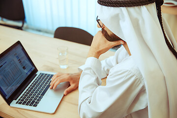 Image showing Arabian saudi businessman working in office