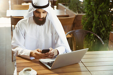 Image showing Arabian saudi businessman working outdoors