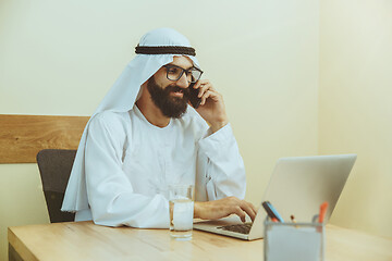 Image showing Arabian saudi businessman working in office