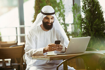 Image showing Arabian saudi businessman working outdoors