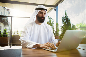 Image showing Arabian saudi businessman working outdoors