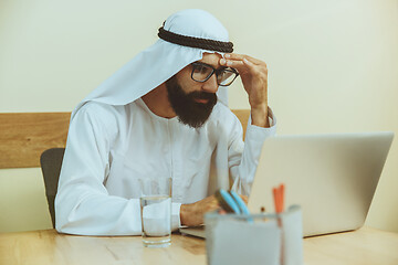 Image showing Arabian saudi businessman working in office