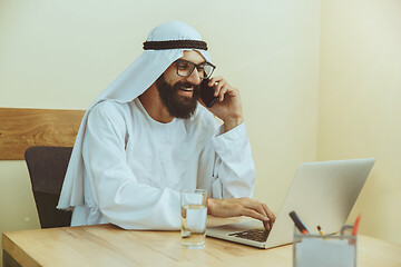 Image showing Arabian saudi businessman working in office