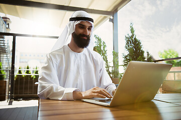 Image showing Arabian saudi businessman working outdoors