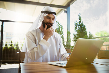 Image showing Arabian saudi businessman working outdoors