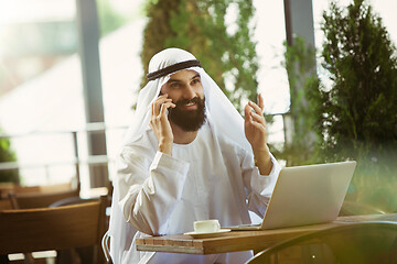 Image showing Arabian saudi businessman working outdoors