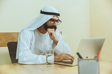 Image showing Arabian saudi businessman working in office