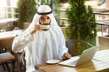 Image showing Arabian saudi businessman working outdoors