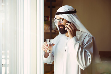 Image showing Arabian saudi businessman working in office