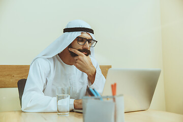 Image showing Arabian saudi businessman working in office