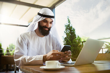 Image showing Arabian saudi businessman working outdoors