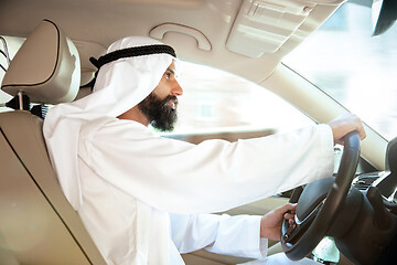 Image showing Arabian saudi businessman driving hir car