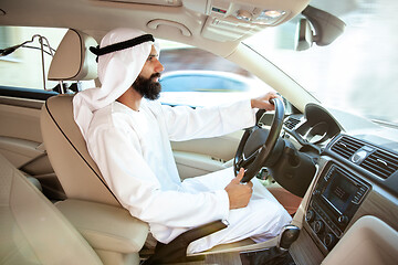 Image showing Arabian saudi businessman driving hir car