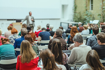 Image showing Man giving presentation in lecture hall at university.