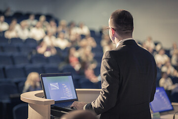 Image showing Public speaker giving talk at business event.