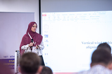 Image showing Muslim businesswoman giving presentations at conference room