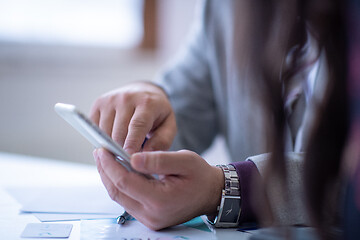 Image showing business people hands using smart phone