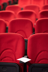 Image showing hall with rows of red seats