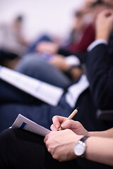 Image showing business people taking notes
