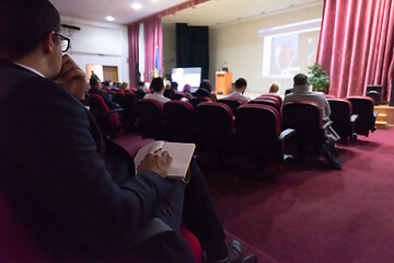 Image showing business people taking notes