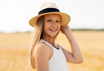Image showing portrait of girl in straw hat on field in summer