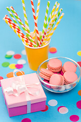 Image showing birthday gift, macarons and paper straws for party