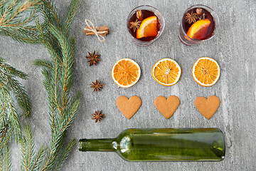 Image showing mulled wine, orange slices, gingerbread and spices