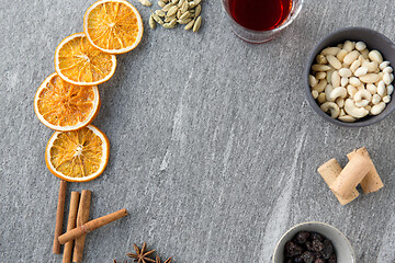 Image showing hot mulled wine, orange slices, raisins and spices