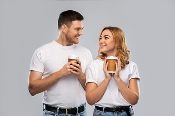 Image showing portrait of happy couple with takeaway coffee cups