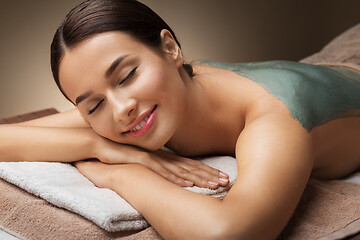 Image showing woman with blue clay mask in spa