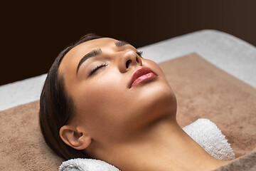 Image showing young woman lying at spa or massage parlor