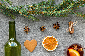 Image showing mulled wine, orange slices, gingerbread and spices