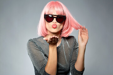 Image showing woman in pink wig and sunglasses sending air kiss