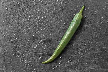 Image showing green chili pepper on slate stone background