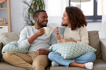 Image showing african american couple drinking coffee at home