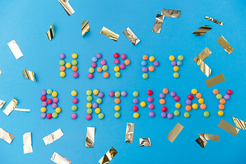 Image showing happy birthday of candies and confetti on blue