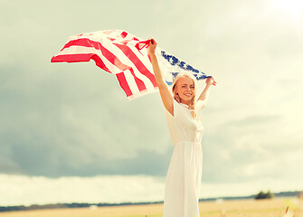 Image showing happy woman with american flag on cereal field