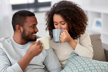 Image showing african american couple drinking coffee at home