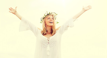 Image showing happy young woman in flower wreath on cereal field