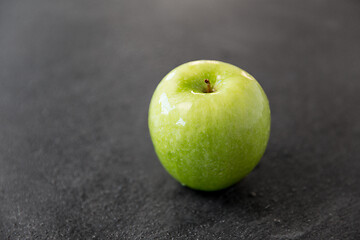 Image showing ripe green apple on slate stone background