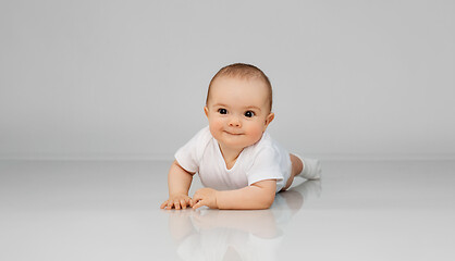 Image showing sweet little baby lying on floor