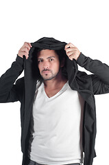 Image showing Young man dressing hoodie isolated on white
