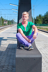 Image showing Handsome blond man sitting on the seat