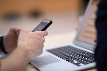 Image showing business people hands using smart phone