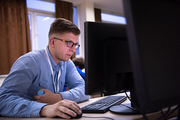 Image showing businessman working using a computer in startup office