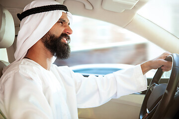Image showing Arabian saudi businessman driving hir car